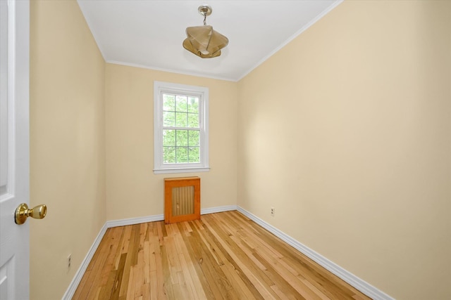 21-22 150th St, Whitestone, NY 11357 - empty room with light wood-style flooring, baseboards, and crown molding