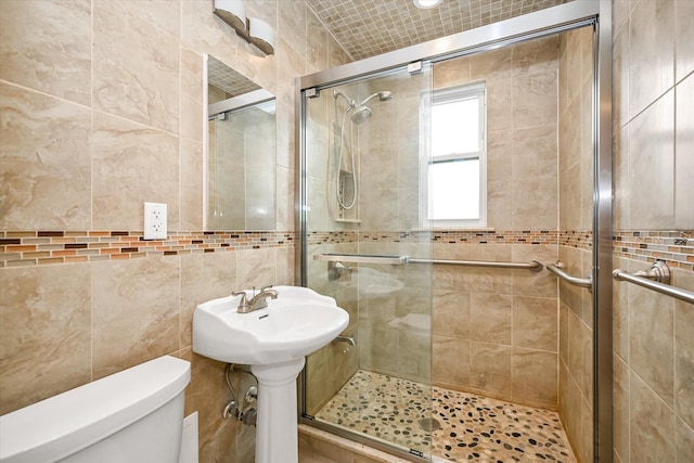 21-22 150th St, Whitestone, NY 11357 - bathroom with a shower stall, toilet, and tile walls