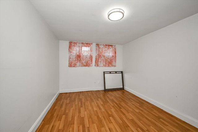 21-22 150th St, Whitestone, NY 11357 - empty room with light wood-style flooring and baseboards