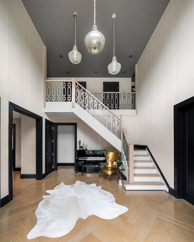 1015 Seven Oaks Ln, Mamaroneck, NY 10543 - living area featuring a high ceiling, stairway, and baseboards
