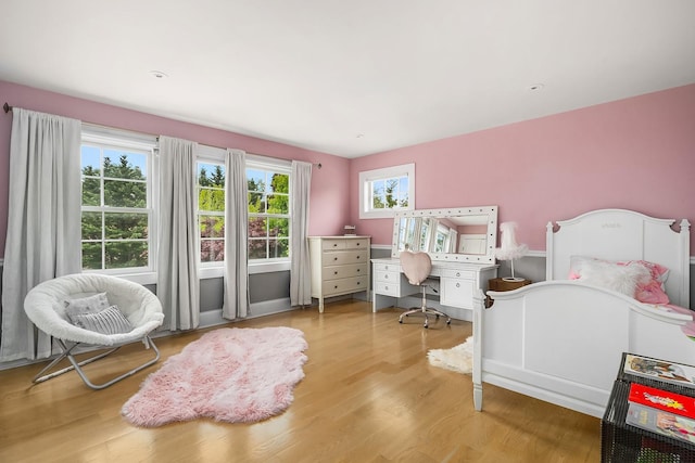 1015 Seven Oaks Ln, Mamaroneck, NY 10543 - bedroom featuring light wood-style flooring and an office area