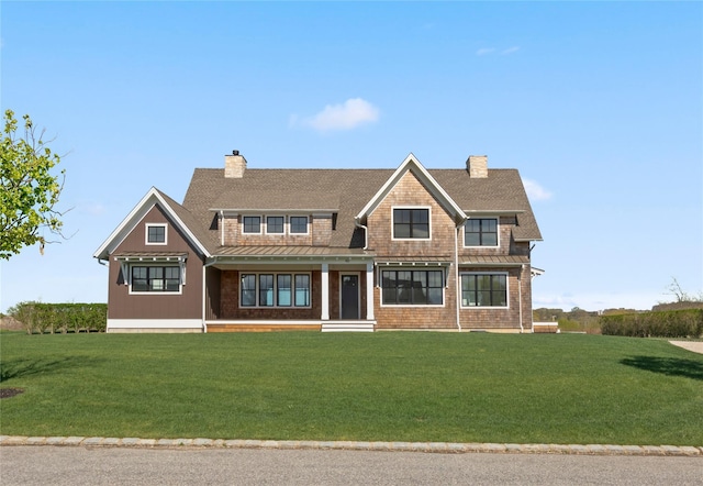 35 Club Dr, Baiting Hollow, NY 11933 - shingle-style home with a chimney, a standing seam roof, covered porch, and a front yard