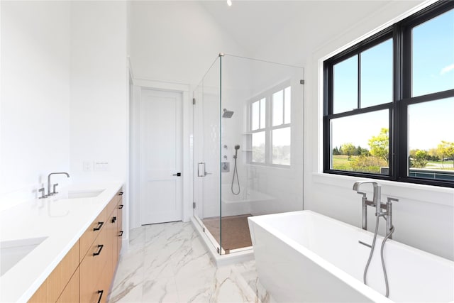 35 Club Dr, Baiting Hollow, NY 11933 - bathroom with a shower stall, marble look tiles, a soaking tub, double vanity, and vaulted ceiling