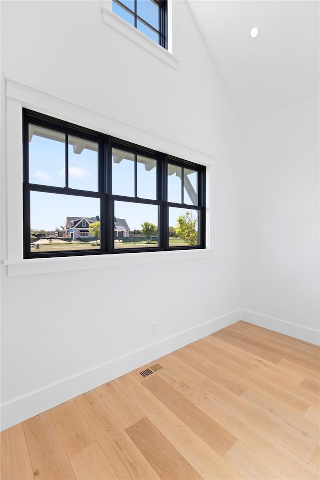 35 Club Dr, Baiting Hollow, NY 11933 - empty room featuring baseboards, plenty of natural light, wood finished floors, high vaulted ceiling, and recessed lighting