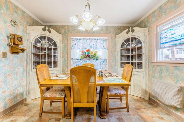 dining area with wallpapered walls, a chandelier, light stone finish floors, baseboards, and ornamental molding