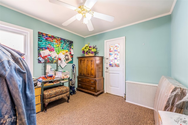 bedroom with light colored carpet, ornamental molding, and a ceiling fan