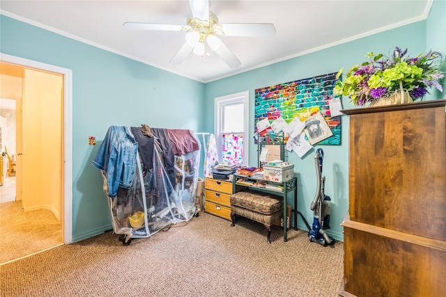 misc room featuring carpet flooring, a ceiling fan, crown molding, and baseboards