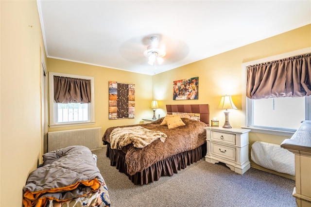 bedroom featuring carpet, ceiling fan, radiator, and ornamental molding
