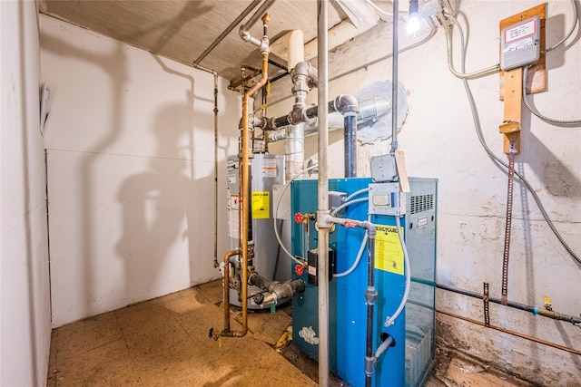 utility room featuring water heater and a heating unit