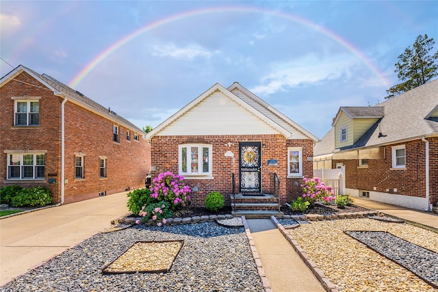 view of front of home with brick siding