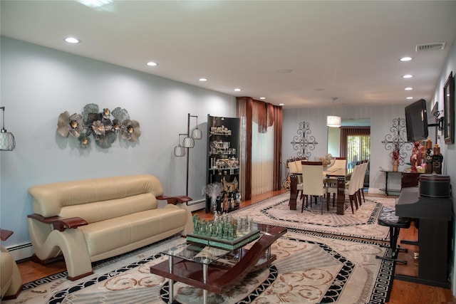 1010 S End, Woodmere, NY 11598 - living room with recessed lighting, wood finished floors, and baseboard heating
