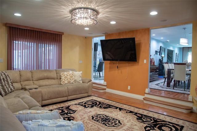 1010 S End, Woodmere, NY 11598 - living area with wood finished floors, a chandelier, recessed lighting, and baseboards