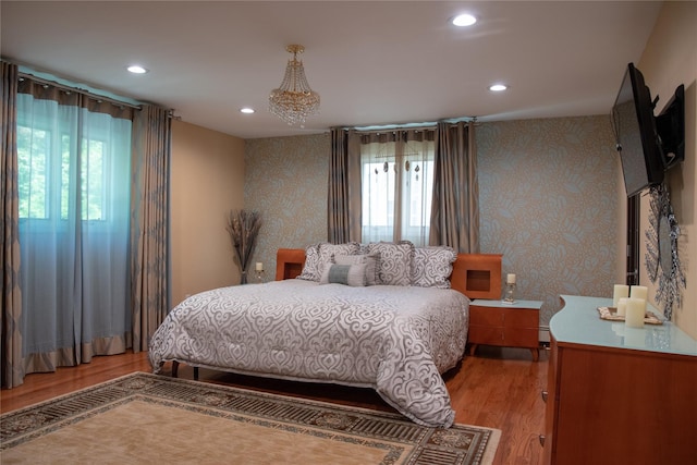 1010 S End, Woodmere, NY 11598 - bedroom featuring light wood finished floors, multiple windows, recessed lighting, wallpapered walls, and a baseboard heating unit
