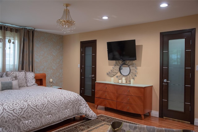 1010 S End, Woodmere, NY 11598 - bedroom with wood finished floors, a chandelier, and recessed lighting