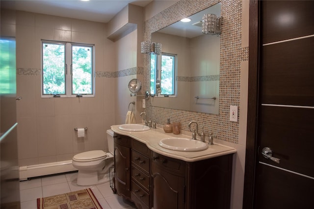 1010 S End, Woodmere, NY 11598 - full bathroom featuring a baseboard heating unit, tile walls, tile patterned flooring, healthy amount of natural light, and double vanity