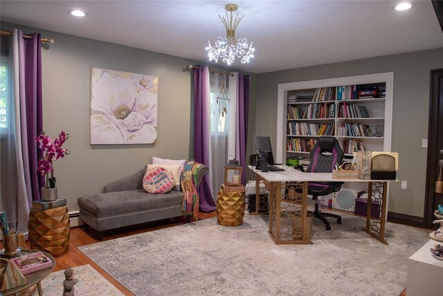1010 S End, Woodmere, NY 11598 - office area featuring wood finished floors, recessed lighting, a chandelier, plenty of natural light, and built in shelves