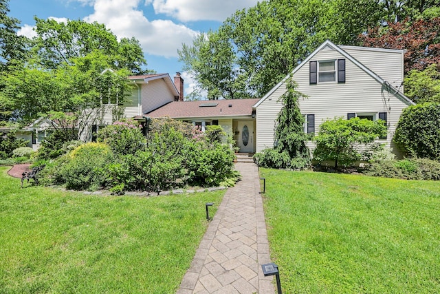 1 Meadowood Path, New Rochelle, NY 10804 - view of front facade featuring a chimney and a front lawn