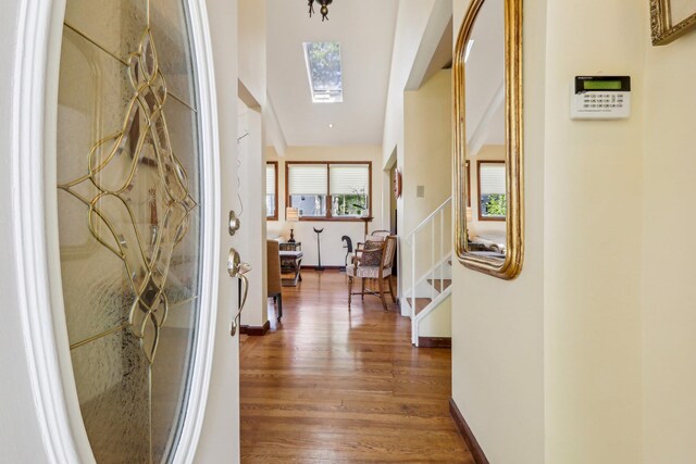 1 Meadowood Path, New Rochelle, NY 10804 - hallway with wood finished floors, a skylight, stairway, and baseboards