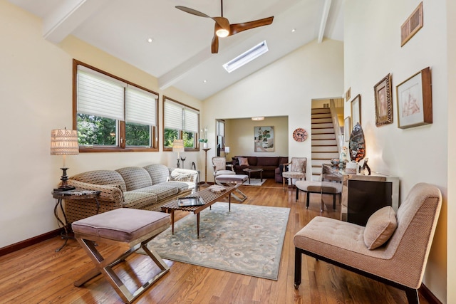1 Meadowood Path, New Rochelle, NY 10804 - living room featuring beam ceiling, a ceiling fan, light wood-type flooring, high vaulted ceiling, and a skylight