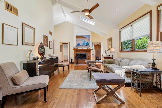 1 Meadowood Path, New Rochelle, NY 10804 - living area with beamed ceiling, ceiling fan, high vaulted ceiling, light wood finished floors, and a fireplace