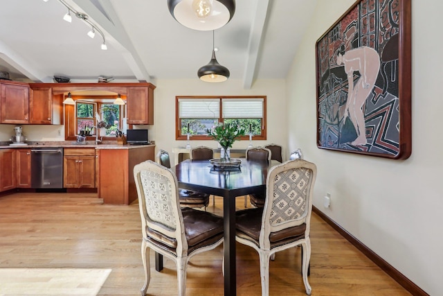 1 Meadowood Path, New Rochelle, NY 10804 - dining room featuring light wood-style flooring, beamed ceiling, track lighting, and baseboards