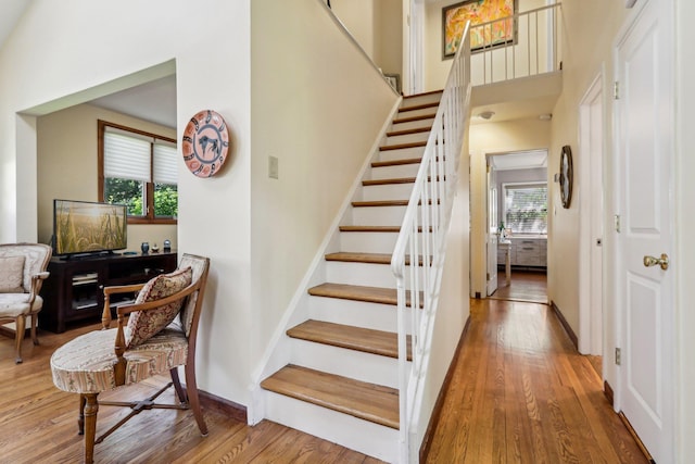1 Meadowood Path, New Rochelle, NY 10804 - stairs with wood finished floors, a towering ceiling, and baseboards