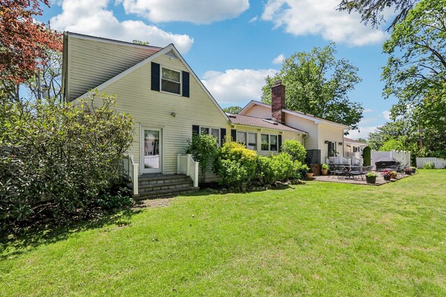 1 Meadowood Path, New Rochelle, NY 10804 - back of house with a patio and a chimney