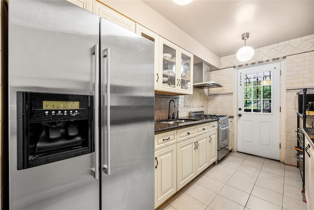 17-12 Starr St, Ridgewood, NY 11385 - kitchen featuring high quality appliances, a sink, wall chimney range hood, dark stone counters, and glass insert cabinets