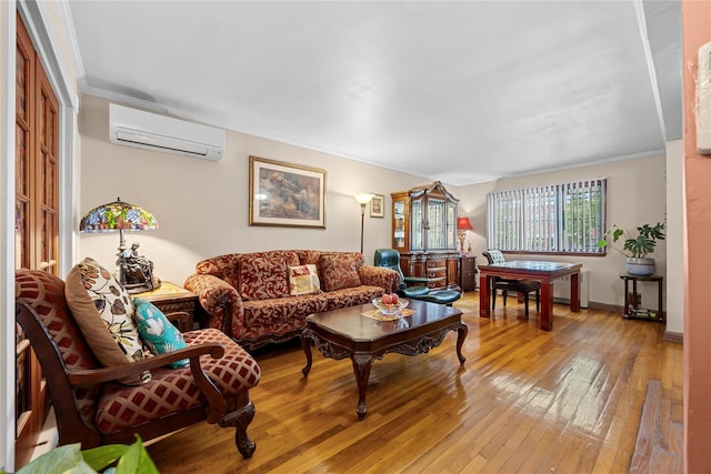 17-12 Starr St, Ridgewood, NY 11385 - living room featuring an AC wall unit, hardwood / wood-style flooring, ornamental molding, and baseboards