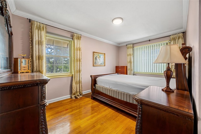17-12 Starr St, Ridgewood, NY 11385 - bedroom with crown molding, light wood-style floors, and baseboards