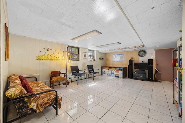 17-12 Starr St, Ridgewood, NY 11385 - living room featuring light tile patterned floors and wood walls