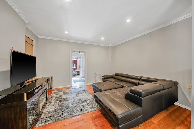 70-27 69th St, Glendale, NY 11385 - living area featuring wood finished floors, crown molding, recessed lighting, and baseboards