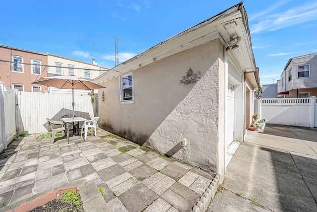 70-27 69th St, Glendale, NY 11385 - fenced backyard featuring outdoor dining area and a patio