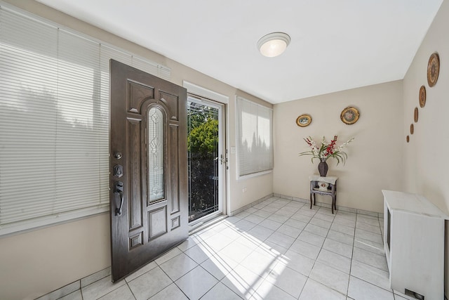 70-27 69th St, Glendale, NY 11385 - entrance foyer with light tile patterned floors and baseboards