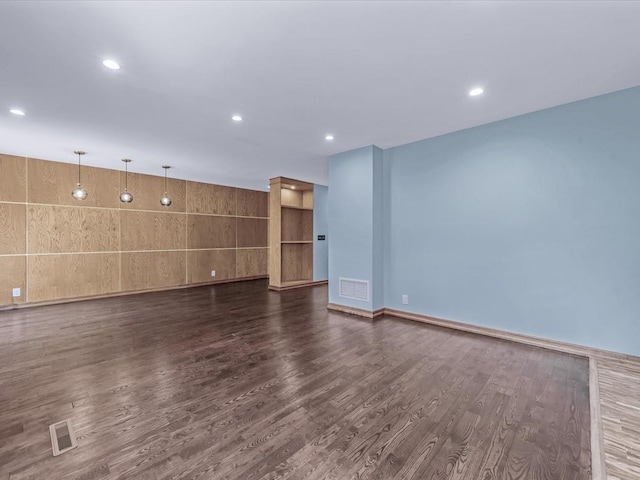 10 Wooleys Ln Unit 1F, Great Neck, NY 11023 - unfurnished living room featuring dark wood-style flooring, recessed lighting, and baseboards