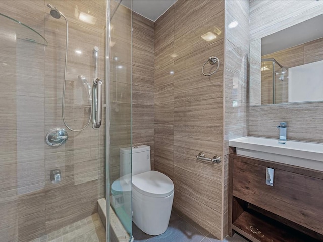 10 Wooleys Ln Unit 1F, Great Neck, NY 11023 - bathroom featuring tile walls, vanity, a stall shower, and toilet