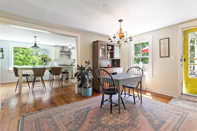 679 Titicus Rd, North Salem, NY 10560 - dining space with hardwood / wood-style floors, baseboards, and a chandelier