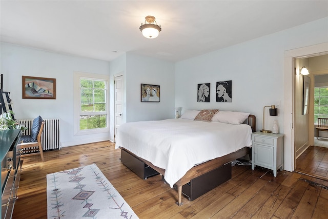 679 Titicus Rd, North Salem, NY 10560 - bedroom featuring radiator, hardwood / wood-style flooring, and baseboards