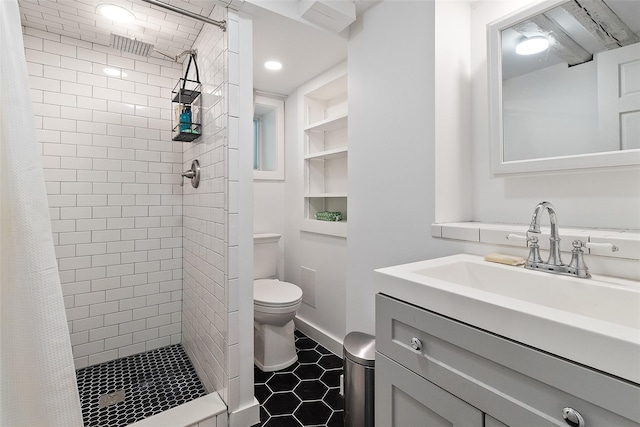 679 Titicus Rd, North Salem, NY 10560 - full bathroom featuring toilet, a shower stall, vanity, tile patterned flooring, and built in shelves