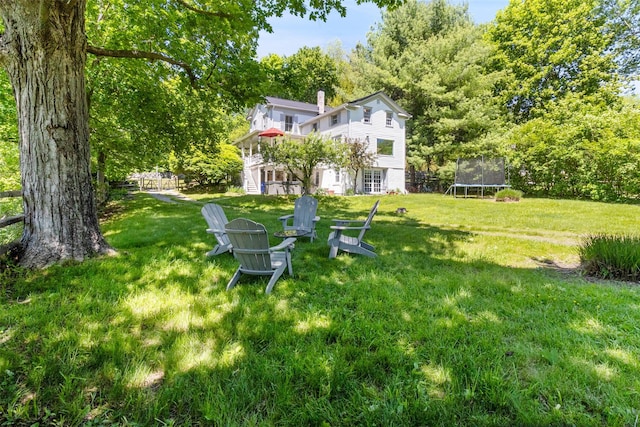 679 Titicus Rd, North Salem, NY 10560 - view of green lawn with a trampoline