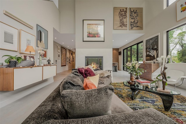 7 Robin Ln, Shelter Island Heights, NY 11964 - living room with a towering ceiling and a glass covered fireplace