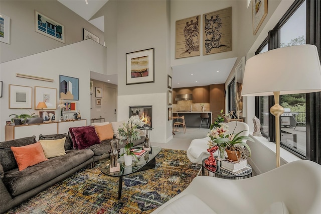 7 Robin Ln, Shelter Island Heights, NY 11964 - living area with a towering ceiling and a glass covered fireplace