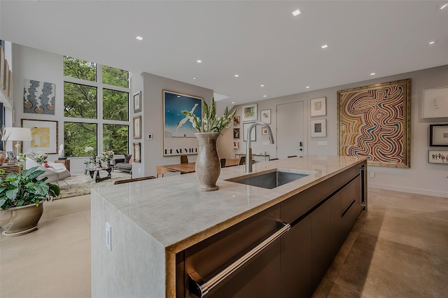 7 Robin Ln, Shelter Island Heights, NY 11964 - kitchen with a sink, a spacious island, open floor plan, concrete flooring, and light stone counters