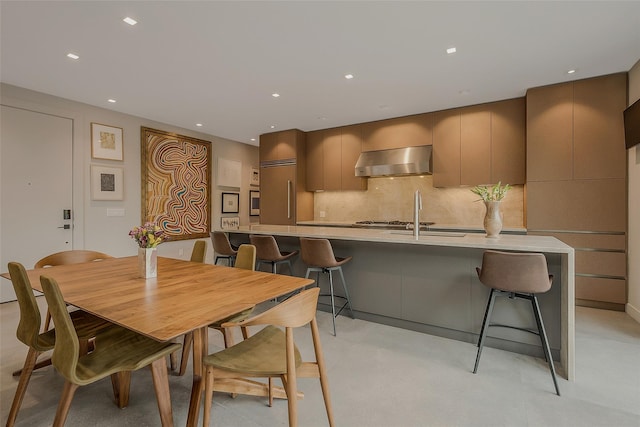 7 Robin Ln, Shelter Island Heights, NY 11964 - dining room featuring finished concrete flooring and recessed lighting