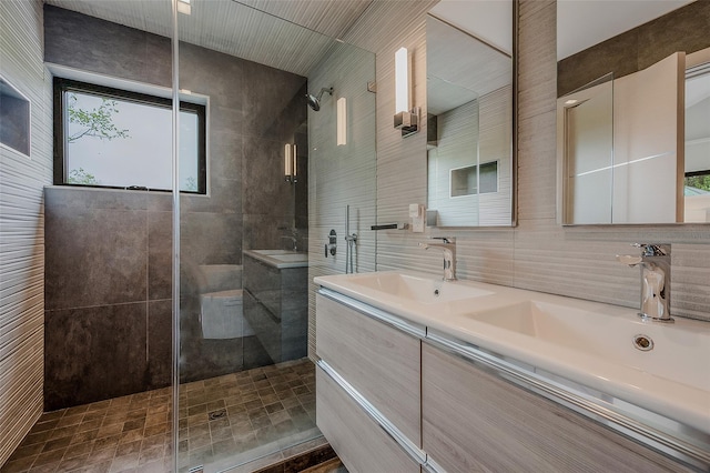 7 Robin Ln, Shelter Island Heights, NY 11964 - bathroom with a shower stall, double vanity, and tile walls