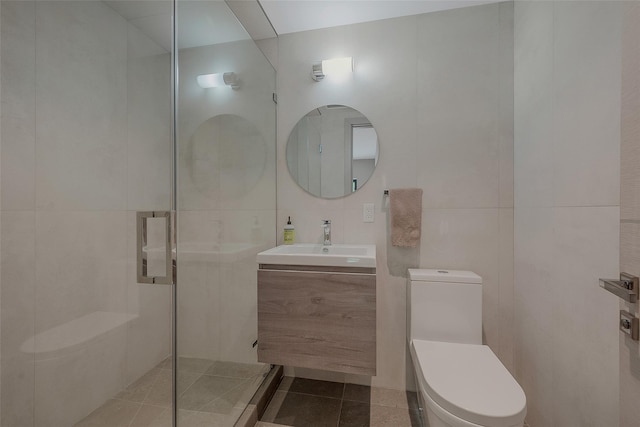 7 Robin Ln, Shelter Island Heights, NY 11964 - full bath featuring tile walls, toilet, a tile shower, vanity, and tile patterned floors