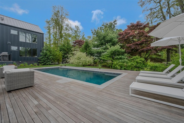 7 Robin Ln, Shelter Island Heights, NY 11964 - swimming pool featuring a wooden deck