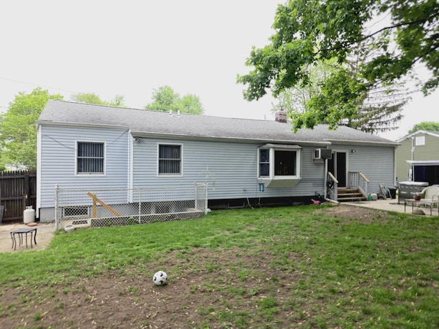 22 E Sycamore St, Central Islip, NY 11722 - back of property with entry steps, a chimney, and a patio area