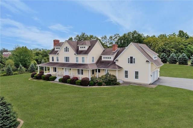 32 Old Chester Rd, Goshen, NY 10924 - view of front facade featuring a porch, driveway, a chimney, and a front lawn