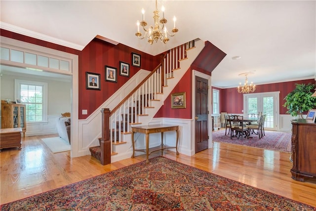 32 Old Chester Rd, Goshen, NY 10924 - foyer entrance with a chandelier, stairway, wood finished floors, a decorative wall, and healthy amount of natural light